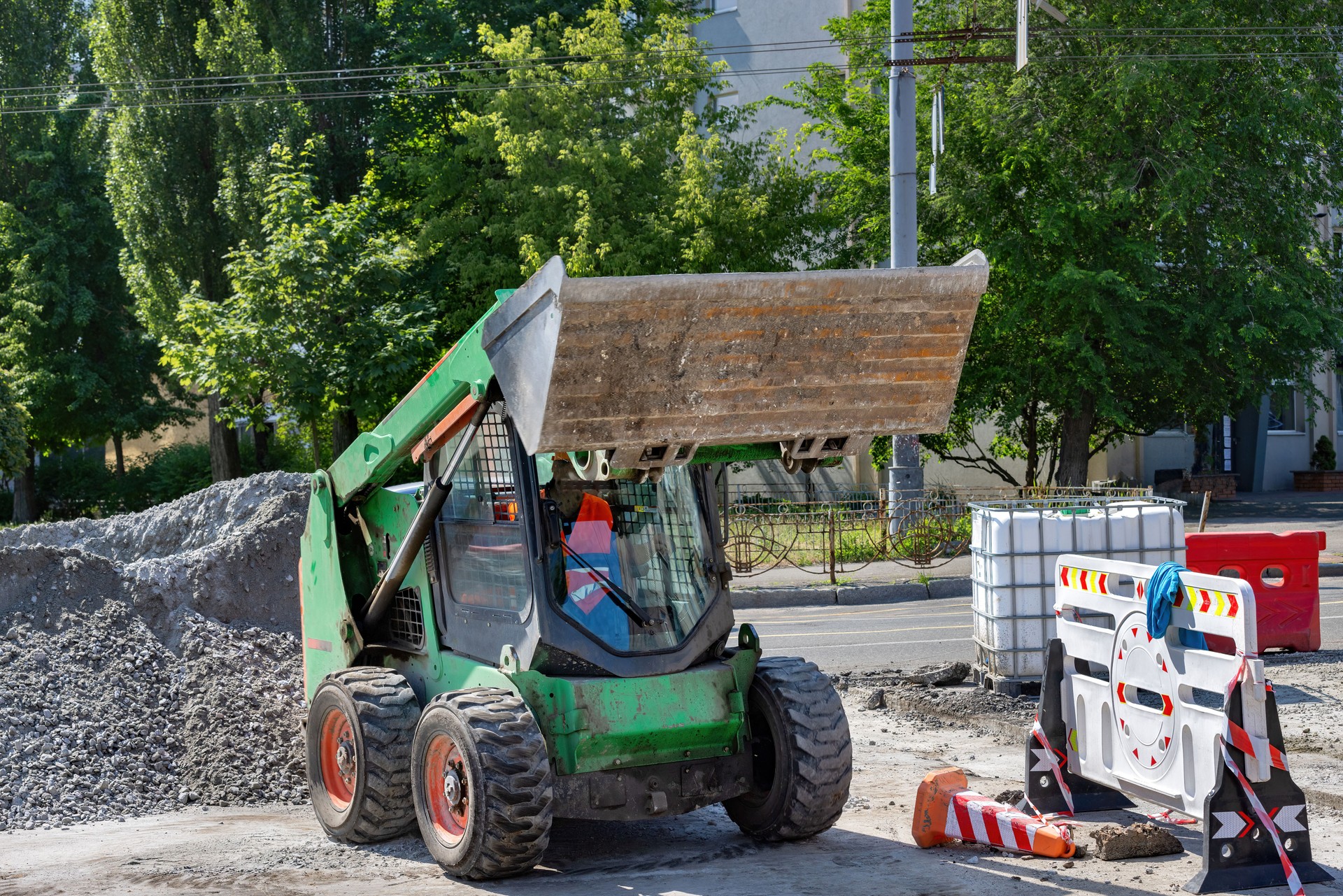 Heavy machinery in action at a construction site during midday