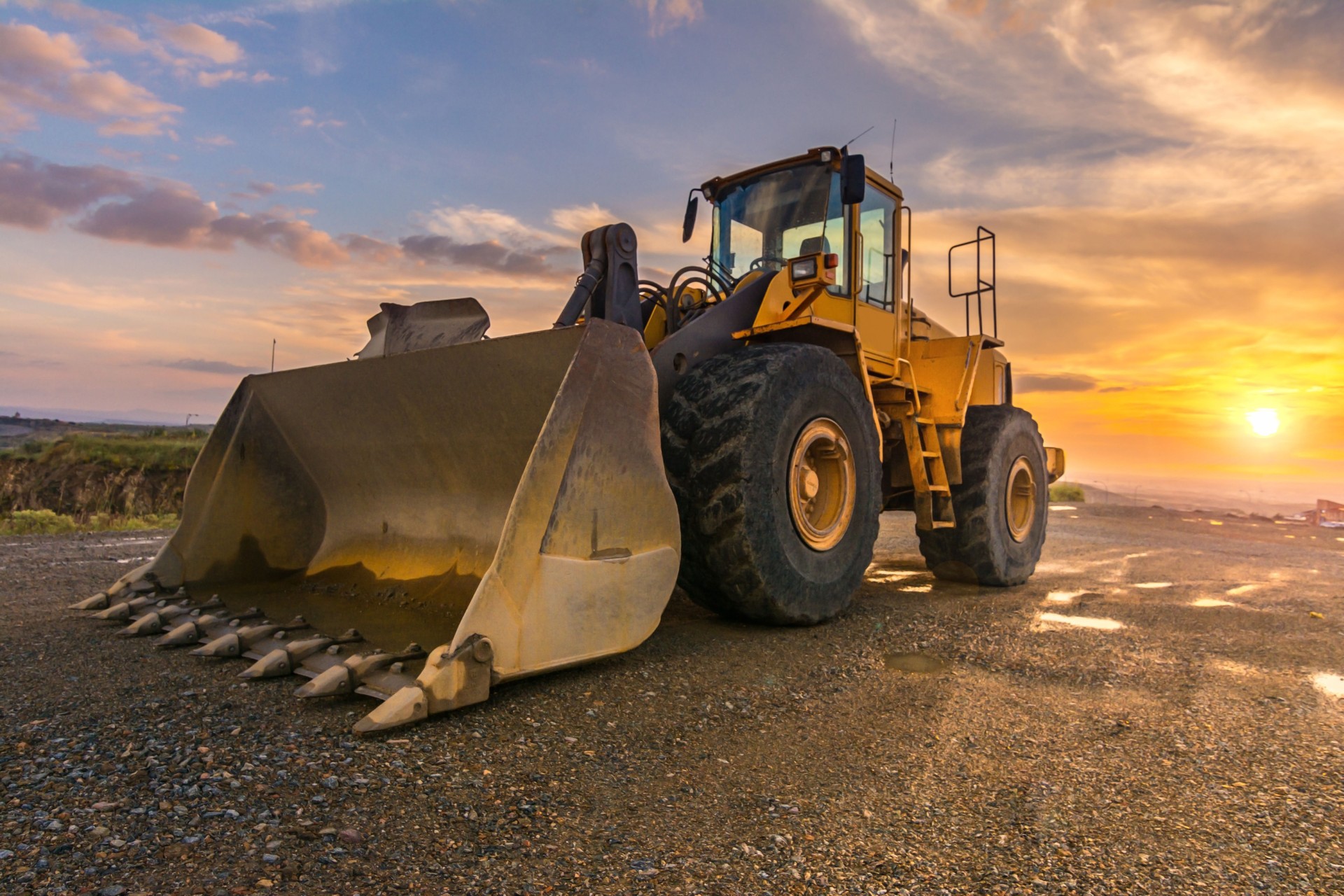 Excavator moving rock in a construction site