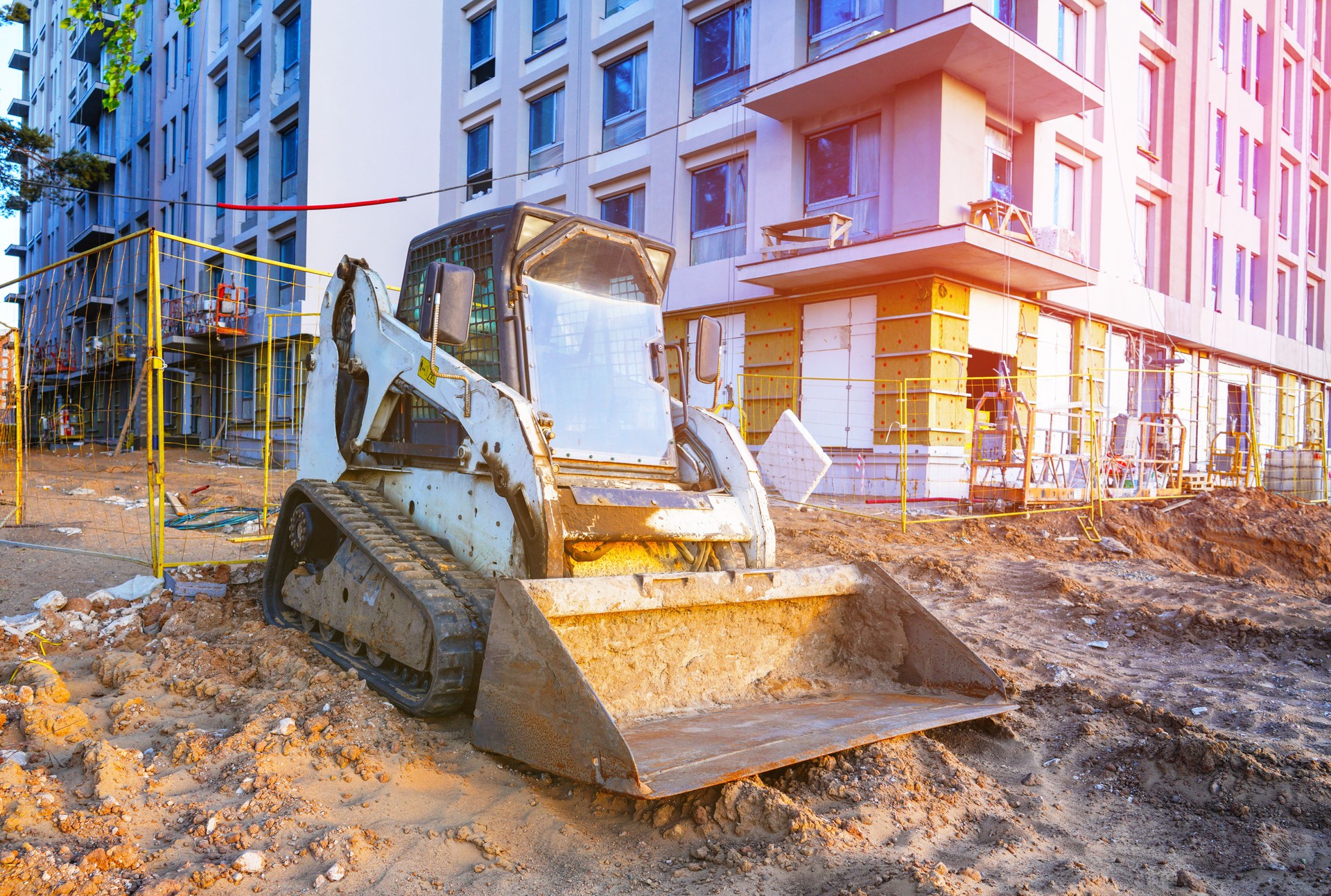 Skid steer loader on construction site. Compact Track loader, construction equipment.
